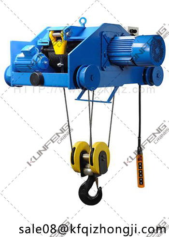 A wire rope electric hoist made of a welded frame and driven by a drive shaft inside the drum